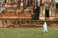 A child and the ruins of buddist temple