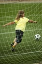 Child run soccer football player. Boy with ball on green grass Royalty Free Stock Photo