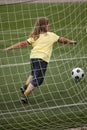 Child run soccer football player. Boy with ball on green grass Royalty Free Stock Photo