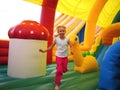 Child running in bouncy castle Royalty Free Stock Photo