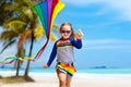 Child with kite. Kids play. Family beach vacation. Royalty Free Stock Photo