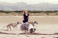 Child running with dogs Royalty Free Stock Photo