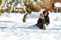 Child running in snowy forest. Toddler kid playing Kids play in snow. Royalty Free Stock Photo