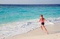 Child running to ocean