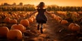 a child runs through a field of pumpkins. symbol of autumn, thanksgiving, halloween