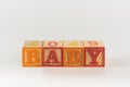A child`s alphabet toy spelling word block set, spelling out the word baby Royalty Free Stock Photo