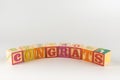 A child`s alphabet toy spelling word block set, spelling out the word congrats Royalty Free Stock Photo