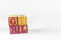 A child`s alphabet toy spelling word block set, spelling out the word girl Royalty Free Stock Photo