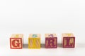 A child`s alphabet toy spelling word block set, spelling out the word girl spacced out Royalty Free Stock Photo