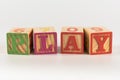A child`s alphabet toy spelling word block set, spelling out the word play Royalty Free Stock Photo