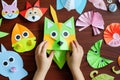 Child\'s artistry: handmade paper animal crafts, flat lay