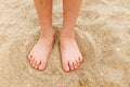 Child's bare feet in sand Royalty Free Stock Photo