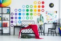 Child`s bedroom with green suitcase