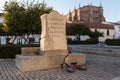 A child`s bicycle thrown next to monolith that marks the house where Hernan Cortes was born