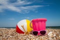 Child's bucket and toys on tropical beach Royalty Free Stock Photo
