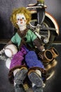 Child`s clown doll on wet mirror with vintage toys