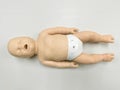 Child`s doll for CPR training and child`s heart massage first aid Royalty Free Stock Photo