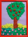 Child`s drawing of apple tree. Handmade plasticine illustration. Children`s creativity