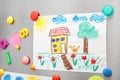 Child`s drawing and magnets on refrigerator door Royalty Free Stock Photo