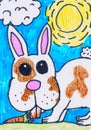 Child s drawing. Rabbit with a carrot.Bunny on the lawn on a Sunny day