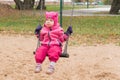 Child`s emotion on the playground in autumn day