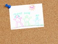 Child's family drawing on cork board