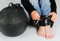 Child's foot and prison ball Royalty Free Stock Photo