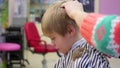 Child`s haircut at the Barber shop