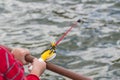 A child`s hand is fishing on a small fishing rod. Ozernaya fishing.