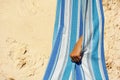 Child's hand in hammock resting during vacation on the beach Royalty Free Stock Photo