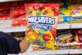 Child`s hand holding a bag of Lifesavers brand gunnies candy Royalty Free Stock Photo