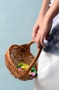 Child`s hand holding easter egg basket Royalty Free Stock Photo