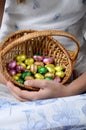 Child`s hand holding easter egg basket Royalty Free Stock Photo