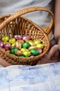 Child`s hand holding easter egg basket Royalty Free Stock Photo