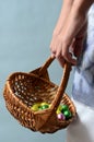 Child`s hand holding easter egg basket Royalty Free Stock Photo