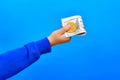 Child`s hand holding one hundred dollar bills and bitcoin Royalty Free Stock Photo