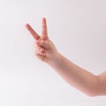 Child`s hand making victory sign. Victory concept. Royalty Free Stock Photo