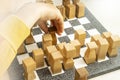 child's hand moving chess pieces on a marble chess board Royalty Free Stock Photo