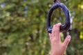 Child`s hand nearly achieving goal of grabbing a monkey bar at a playground conecept trying and striving to holding on for