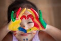 Child`s hand with painted colorful watercolor make heart shape