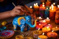 Child\'s hand painting an elephant figurine, adding a personal touch to Diwali gift