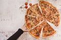 Child`s hand taking a slice of pizza. Homemade pizza with natural ingredients Royalty Free Stock Photo