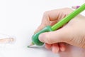 Child`s hand with writing tool for help by incorrect holding of pencil Royalty Free Stock Photo