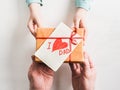 Child's hands and adult man's hands  beautiful gift box Royalty Free Stock Photo