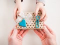 Child`s hands and a beautiful gift box Royalty Free Stock Photo
