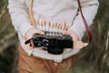 Child`s hands close-up with vintage retro camera. Boy studying to take pictures. Royalty Free Stock Photo