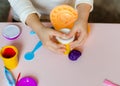 Child`s hands with colorful clay. Plastiline.