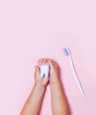 Child`s hands holding big tooth and toothbrush Royalty Free Stock Photo