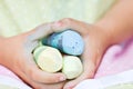 Child's hands holding colored chalk