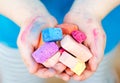 Child's hands holding colored chalk pieces Royalty Free Stock Photo